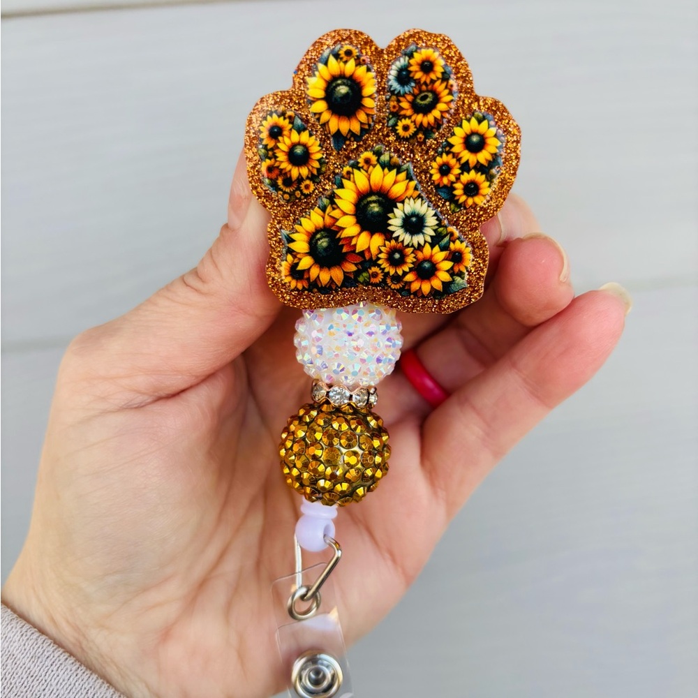 Sunflower paw print badge reel